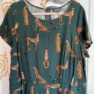 Modcloth dark green cheetah jumpsuit. Short sleeve, bootcut leg, pockets